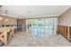 Open living room with marble floors and French doors offers abundant space to renovate at 1233 Eden Isle Ne Dr, St Petersburg, FL 33704