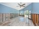 Living room with vaulted ceiling, natural light, and outdoor access at 1233 Eden Isle Ne Dr, St Petersburg, FL 33704