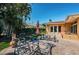 Backyard patio area featuring brick pavers and outdoor seating at 1233 Eden Isle Ne Dr, St Petersburg, FL 33704