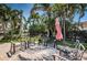 Outdoor patio with brick pavers features a seating area with view of the waterfront at 1233 Eden Isle Ne Dr, St Petersburg, FL 33704