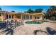 Backyard patio area featuring brick pavers, outdoor seating, and swimming pool at 1233 Eden Isle Ne Dr, St Petersburg, FL 33704
