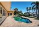 Backyard pool and patio featuring a kidney bean shaped pool with pavers at 1233 Eden Isle Ne Dr, St Petersburg, FL 33704