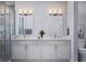 Spacious bathroom featuring double sinks, ample counter space, and a separate shower for ultimate convenience at 13298 High Springs Ave, Port Charlotte, FL 33981