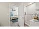 Bathroom featuring a tiled shower and a doorway to a bedroom at 14407 Alistar Manor Dr, Wimauma, FL 33598