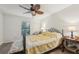 Bedroom featuring a decorative ceiling fan, natural light, and wood-look floors at 14407 Alistar Manor Dr, Wimauma, FL 33598