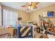 Cozy craft room offers a ceiling fan, vinyl floors and bright natural light at 14407 Alistar Manor Dr, Wimauma, FL 33598