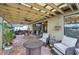 Relaxing outdoor space with comfortable seating, ceiling fans, patio furniture, and a view of the garden at 14407 Alistar Manor Dr, Wimauma, FL 33598