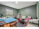 Bright craft room featuring a large table, storage, and ample natural light at 14407 Alistar Manor Dr, Wimauma, FL 33598