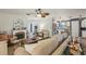 Open-concept living room and kitchen featuring a fireplace and stylish decor at 14407 Alistar Manor Dr, Wimauma, FL 33598