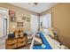 Sewing room with professional sewing machine, storage, and natural light at 14407 Alistar Manor Dr, Wimauma, FL 33598