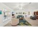 Bright living room with stylish furnishings, large windows, and wood floors at 1479 Arredondo St, North Port, FL 34286