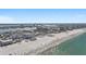 An impressive aerial view captures the condo building nestled near the beach and ocean at 15 Avalon St # 601, Clearwater Beach, FL 33767