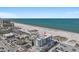 An aerial shot showcases a luxurious condo building right on the beach, with convenient parking and easy access to the ocean at 15 Avalon St # 601, Clearwater Beach, FL 33767