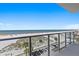 Enjoy stunning ocean views from this balcony with clear railings, overlooking the beautiful beach and parking area at 15 Avalon St # 601, Clearwater Beach, FL 33767