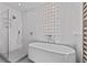 Modern bathroom featuring a soaking tub and separate glass shower at 15 Avalon St # 601, Clearwater Beach, FL 33767