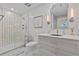 Updated bathroom featuring a seamless glass shower and sleek vanity at 15 Avalon St # 601, Clearwater Beach, FL 33767