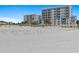 Beautiful condo buildings from the beach, with modern architecture and lush palm trees enhancing the coastal charm of the property at 15 Avalon St # 601, Clearwater Beach, FL 33767