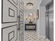 Elegantly designed hallway with decorative lighting, mirror, and stylish flooring near elevator at 15 Avalon St # 601, Clearwater Beach, FL 33767