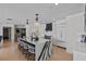 Open-concept kitchen with an island, seating, modern appliances, and ample storage at 15 Avalon St # 601, Clearwater Beach, FL 33767