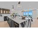 Contemporary kitchen featuring an island with waterfall countertops, stylish pendant lights and ocean views at 15 Avalon St # 601, Clearwater Beach, FL 33767