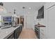 Beautiful kitchen with waterfall countertops and modern black accents at 15 Avalon St # 601, Clearwater Beach, FL 33767