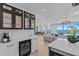 Bright, modern kitchen with an island, a wine cooler, and beautiful views of the beach at 15 Avalon St # 601, Clearwater Beach, FL 33767