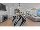 Open-concept kitchen with a large island with modern appliances and views of the living area at 15 Avalon St # 601, Clearwater Beach, FL 33767