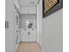 Well-lit laundry room with white cabinetry, appliances, and countertop at 15 Avalon St # 601, Clearwater Beach, FL 33767
