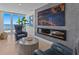 Comfortable living room with a fireplace and ocean view at 15 Avalon St # 601, Clearwater Beach, FL 33767