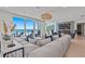 Comfortable living room featuring an oversized sectional and ocean views at 15 Avalon St # 601, Clearwater Beach, FL 33767