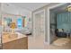 Inviting main bedroom leading to an ensuite and sitting area at 15 Avalon St # 601, Clearwater Beach, FL 33767