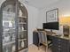 Home office featuring a sleek black desk, decorative shelving, and a modern display at 15 Avalon St # 601, Clearwater Beach, FL 33767