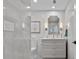 Contemporary powder room featuring white cabinetry and stylish mirror at 15 Avalon St # 601, Clearwater Beach, FL 33767