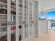 Custom walk-in closet with glass doors, custom lighting and city views at 15 Avalon St # 601, Clearwater Beach, FL 33767