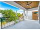 Outdoor balcony with views of the neighborhood, a wooden ceiling, and a ceiling fan at 1741 Nevada Ne Ave, St Petersburg, FL 33703