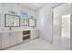 Spacious bathroom with marble tiling, double vanity with storage, and modern fixtures at 1741 Nevada Ne Ave, St Petersburg, FL 33703
