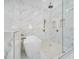 Beautiful bathroom featuring marble tiling, a soaking tub and glass shower at 1741 Nevada Ne Ave, St Petersburg, FL 33703