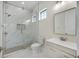 Modern bathroom featuring glass shower and vanity with drawers at 1741 Nevada Ne Ave, St Petersburg, FL 33703