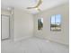 Bright bedroom with two large windows and modern ceiling fan at 1741 Nevada Ne Ave, St Petersburg, FL 33703