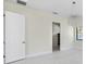 Bright bedroom area featuring modern lighting and doorway at 1741 Nevada Ne Ave, St Petersburg, FL 33703