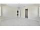 Open bedroom area with modern lighting and a view of the stylish kitchen at 1741 Nevada Ne Ave, St Petersburg, FL 33703