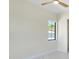 Bright bedroom featuring a ceiling fan, a window and sleek marble floors at 1741 Nevada Ne Ave, St Petersburg, FL 33703