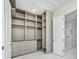 Spacious walk-in closet with custom shelving and drawers at 1741 Nevada Ne Ave, St Petersburg, FL 33703