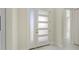 Stylish white front door with frosted windows, complementing the interior's clean design at 1741 Nevada Ne Ave, St Petersburg, FL 33703