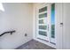 Modern white front door with windows, adding curb appeal to the home's entrance at 1741 Nevada Ne Ave, St Petersburg, FL 33703
