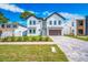 Beautiful two-story home with a well-manicured front lawn and a spacious driveway at 1741 Nevada Ne Ave, St Petersburg, FL 33703