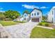 Charming two-story home featuring a modern design and a neatly paved driveway at 1741 Nevada Ne Ave, St Petersburg, FL 33703
