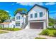 Attractive two-story home with a front-facing garage and a well-maintained yard at 1741 Nevada Ne Ave, St Petersburg, FL 33703