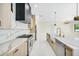 Spacious kitchen featuring marble countertops, stainless steel appliances, and a modern black range hood at 1741 Nevada Ne Ave, St Petersburg, FL 33703