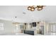 Open concept view of kitchen, showing custom cabinets, marble counters, modern appliances and lighting at 1741 Nevada Ne Ave, St Petersburg, FL 33703